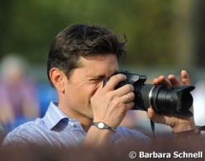 Donnperignon's former owner and rider Christoph Koschel taking pictures of Kasprzak on his "Pepe"
