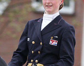 The logo of the Dutch Olympic Horse Foundation stitched on Coby van Baalen's 2000 Olympic tails, now worn by her student Dutch Young Rider Debora Pijpers :: Photo © Astrid Appels