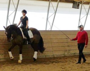 USEF Youth Riders Coach Jeremy Steinberg helping out young rider Kate Hillier on Toy Soldier with the half steps