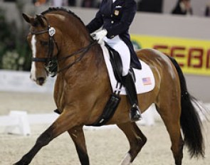 American Shawna Harding on Come On III. She was late entering the ring, which cost her points. The passage and piaffe are nice but the transitions difficult. A mistake in the two tempi's reduced the score further