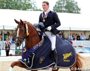 Michael Eilberg and Woodlander Farouche win the 6-year old finals at the 2012 World Young Horse Championships :: Photo © LL-foto.de