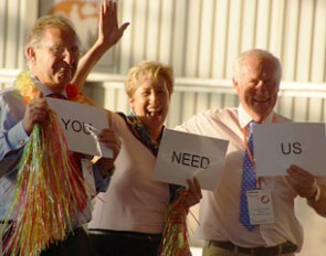 Judges Gustaf Svalling, Ricki MacMillan & FEI vet Grant Poolman were very competitive and tried to bribe the panel with their sign "you need us" in the hula hoop competition at 2013 CDI Orange