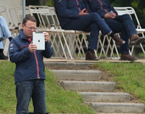 Alex Hardwick's dad videoing his daughter's ride with the iPad while the British chef d'equipe is watching as well