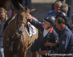 Roger Yves Bost pats his gold medal mare Myrtille Paulois after their winning round at the 2013 European Show Jumping Championships :: Photo © Astrid Appels