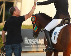 Hannah Cichos and her dad high five