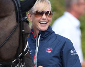 American WEG team rider Katherine Bateson-Chandler cuddling with Valegro