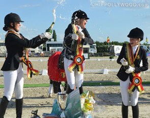 Belgian Pony Champion Lavinia Arl gets a champagne shower during the medal ceremony :: Photo © Hippollywood.com