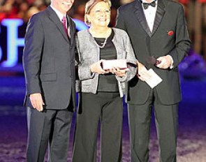 Judge Stephen Clarke and FEI Dressage Director Trond Asmyr honour Belgian O-judge Mariette Withages who is retiring from international judging duties