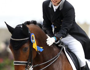 Corentin Pottier patting Gotcha in the prize giving ceremony