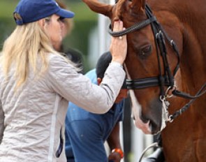 Trainer Ashley Holzer pats Jewel's Adelante