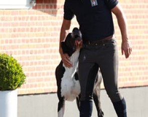 Rob gives his dog big cuddles