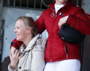 Pony friends hang out near the stables and watch the class