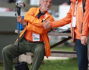 Adelinde's dad Wim Cornelissen shakes hands with Dutch team trainer Wim Ernes