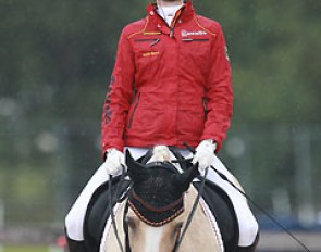 Helen's twin sister Linda Erbe checks out the rain when she begins her warm up on Dujardin B