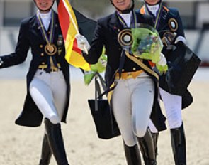 The kur medalists in their lap of honour