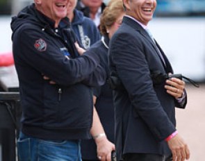 Rosamunde's former owner Jochen Arl and U.S. team coach Robert Dover cheer as Steffen Peters finishes his test