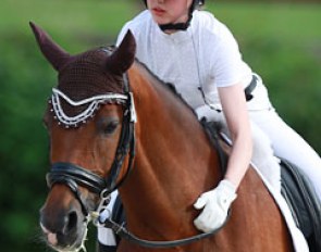 Swiss Renee Stadler hugging Dolce Vita, the pony who was first known in the international ring as Oualidaluna