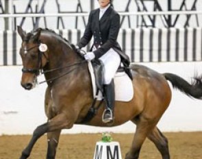 Taylor Rowsey and Poulidon claimed the blue ribbon in the FEI Intermediaire I despite dealing with major flooding at her Houston area farm just days before the competition. Photo by Susan J. Stickle