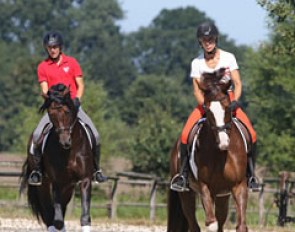 Open training day at Ingrid Klimke's yard. Ingrid on Geraldine, Franziskus getting warmed up in the back ground