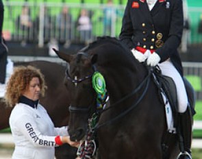 Groom Liz Geldard gives a lump of sugar to Orthilia during the prize giving