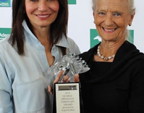 Carol Cohen presents Janne Rumbough with the Global Dressage Visionary Award during Week 8 of the 2016 Adequan Global Dressage Festival