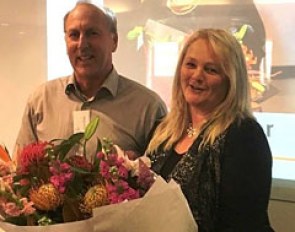 Karen Trotter receiving her Honorary Life Membership badge and flowers from ESNZ Vice President, Nick Pyke at the 2016 ESNZ General Assembly.