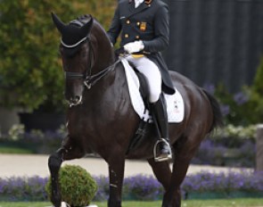 Severo Jurado Lopez on Marianne Helgstrand's Deep Impact. The black has a spectacular passage but the right hind is thrown out from under the body. The single tempi changes and extended canter were the highpoints