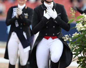 Cathrine Dufour holds her heart as she steps onto the podium to receive the bronze medal
