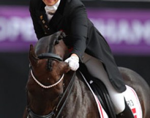 Anna Kasprzak pulls Donnperignon's ear at the end of their freestyle, which ranked them seventh