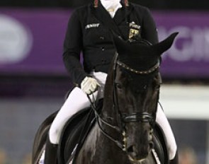 Isabell Werth smiles at the crowds as they begin clapping in her final passage line