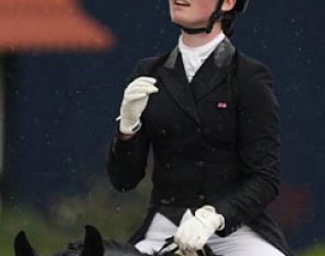 British Emily Bradshaw looks up at the rain she had to ride in