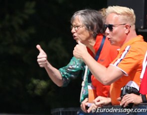 Trainer Tineke Bartels and Maarten van der Heijden, the Dutch federation's technical director for dressage, give Madeleine Witte-Vrees thumbs' up