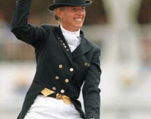 Anky van Grunsven raises her arm in victory