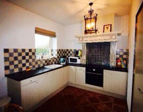 The kitchen in the studio that is part of the unit for rent