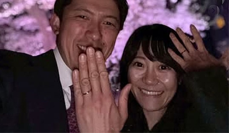Shingo Hayashi and Sayo got engaged. Posing in front of a Japanese cherry tree in full bloom
