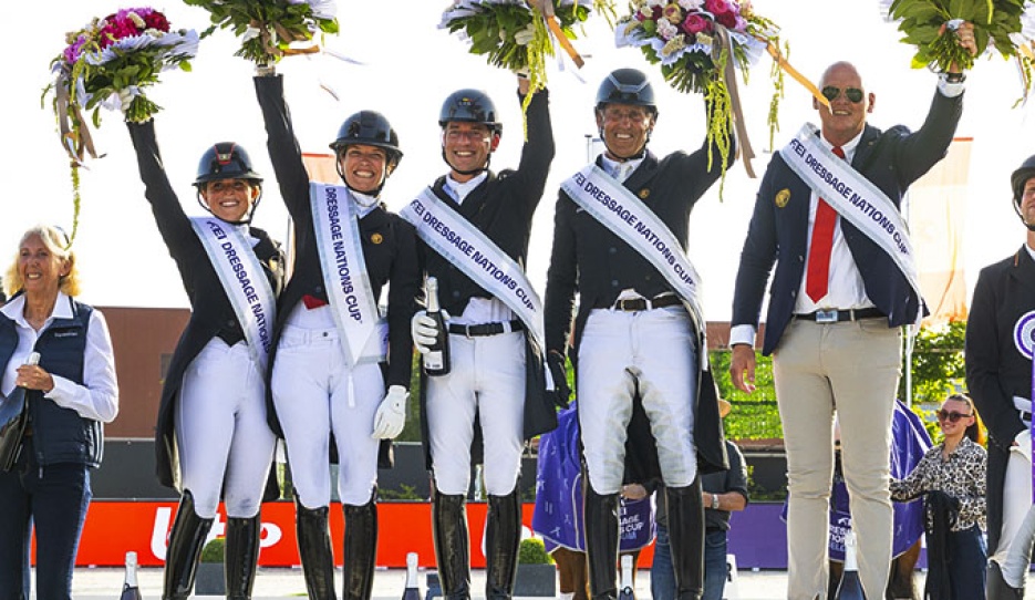 Defalque, Pauluis, Verboomen, Verwimp and chef d'equipe Jeroen van Lent on the podium for Belgium's FEI Nations Cup win at the 2026 CDIO Lier