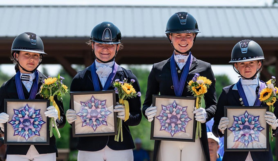 The gold medal winning junior team (ee Dravilas, Madelynn Williams, Autumn Vavrick, and Grace Christianson) at the 2026 NAYC :: Photo © Centre Line Media