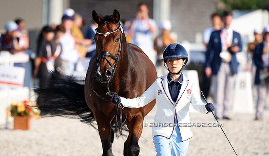 The competition's youngest competitor: Hong Kong's Kendra Li trotting up Ferati at the 2026 Asian Games :: Photo © Astrid Appels