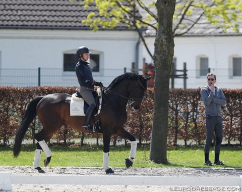 Japanese Hiroyuki Kitahara schooling his newest horse Huracan (by Hotline x Don Schufro) in Aachen. Henri Ruoste is coaching