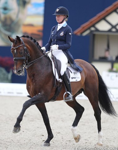 Rose Mathisen and Zuidenwind. The noseband snapped at the of the test but Mathisen still completed the ride although the horse often had his mouth wide open (even before the snapping)