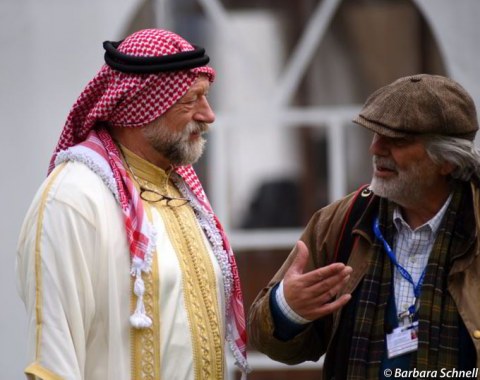 German ringmaster Pedro Cebulka (dressed up as a Jordanian for the Horses & Dreams Meets the Royal Kingdom of Jordan) chatting with German-Syrian equestrian photographer Jacques Toffi