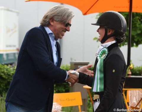 Show host Franz Josef Dahmen congratulates Trine Mittag Jensen