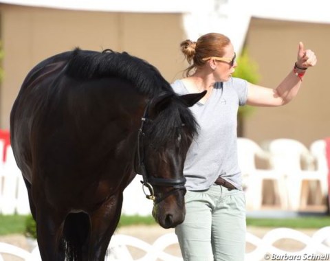 Balkenhol's groom Christina hand walking Heuberger