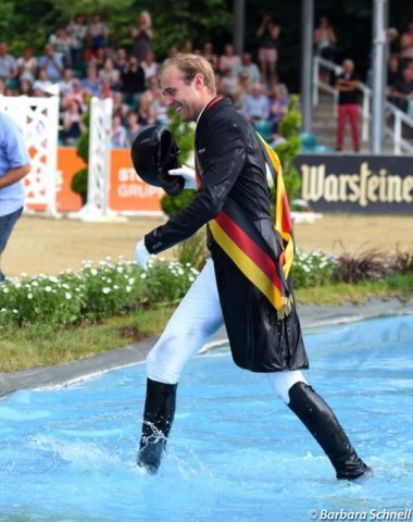 Traditionally the German champion gets thrown into the water jump