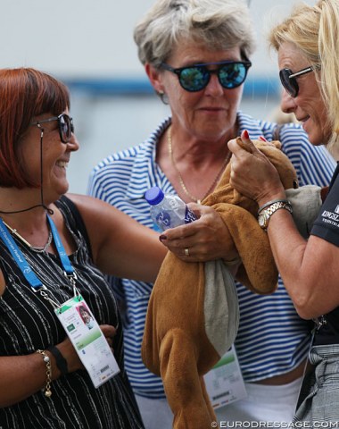 Cathrine Dufour's mascot, teddy bear "Gerd Dörich” has been with her from her pony days all the way up to seniors. Cathrine's mom holds the bear, Danish chef d'equipe Helle Trolle hugs it