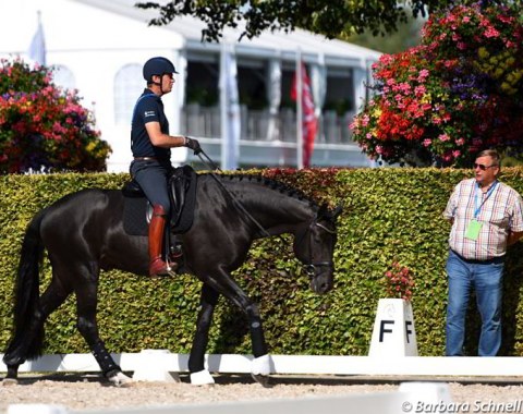 Emile Faurie walking Delation, coach Hartmut Lammers by his side