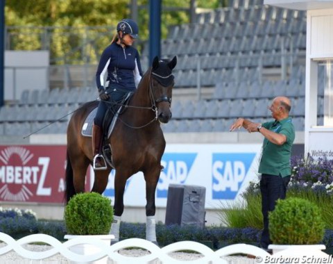 Dorothee Schneider getting tips from German assistant team trainer Jonny Hilberath