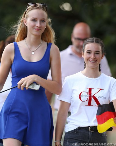 Linda Erbe and Romy Allard walking over to the show ring to root for their team mates