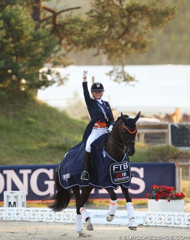 Esmee Donkers rides her lap of honour on Chaina in the setting sun