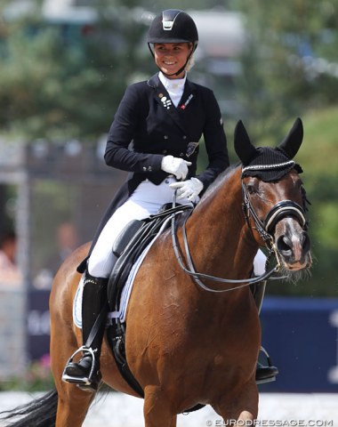 Finnish Janni Martikainen on the Belgian warmblood Cornando van de Cadzandhoeve. Big smile for her 69.029% score. 